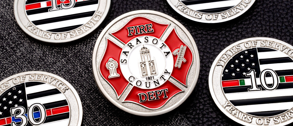 Sarasota County Fire Department maltese cross challenge coin surrounded by thin red line years-of-service coins